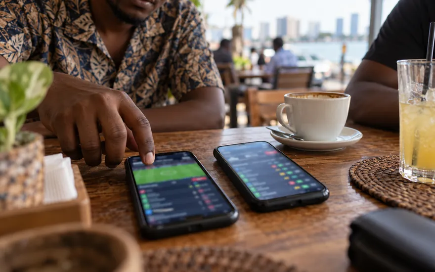 Comparing prices on the best betting sites in Tanzania on two phones side by side